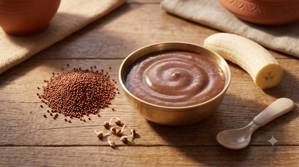 Bowl of sprouted ragi porridge for babies with ragi grains and banana on the side
