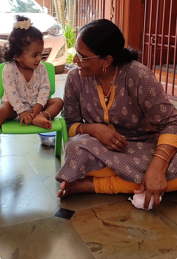 Indian grandmother and her granddaughter sharing a happy moment together